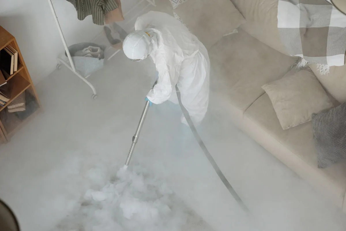 Biohazard cleanup technician in protective equipment, Carlyss, LA